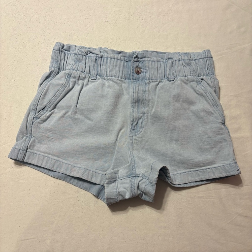 American Eagle light wash stretch denim shorts featuring an elastic ruffle waist